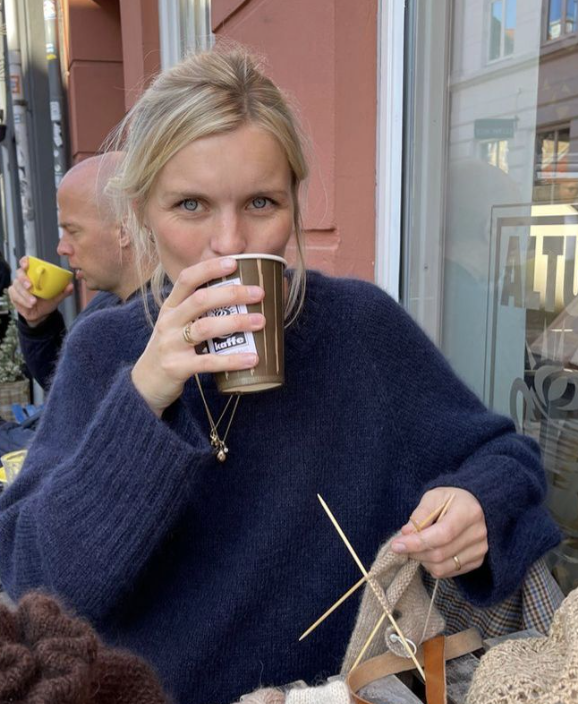 Sandra — user persona, woman drinking coffee while knitting