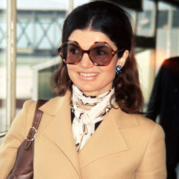 Jackie O in tan coat with scarf