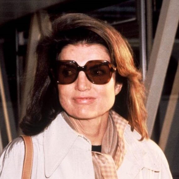 Jackie O in white jacket with gingham scarf