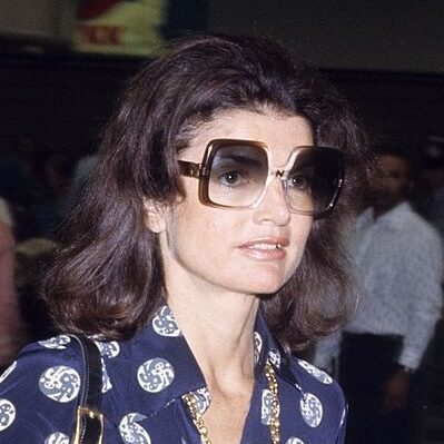 Jackie O in blue polka dot blouse