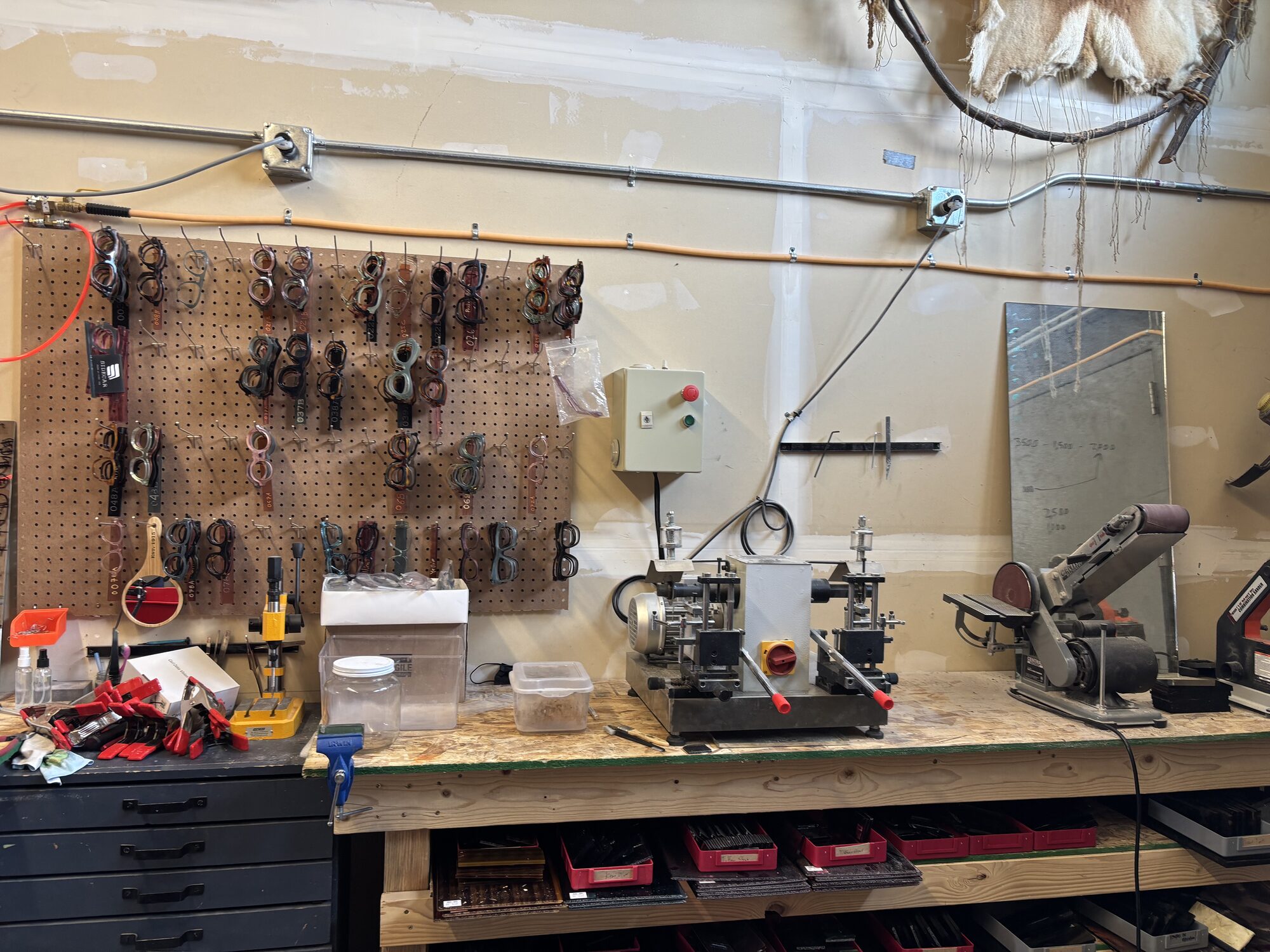 Pegboard with frames and belt sander workbench